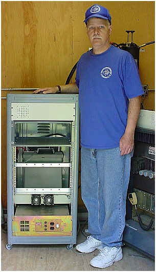 Mark, N8UVQ standing next to the SHARC-3 Repeater